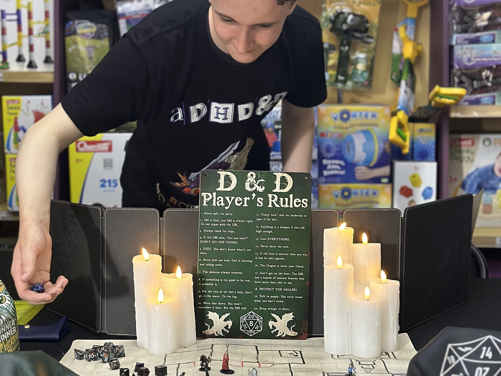 Zaden preparing the D&D table at Professor Plums in Crows Nest