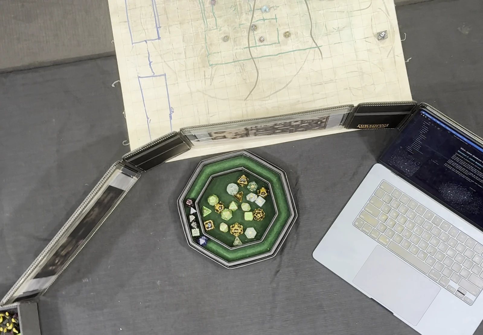 Metal and jade dice in an octagonal dice tray